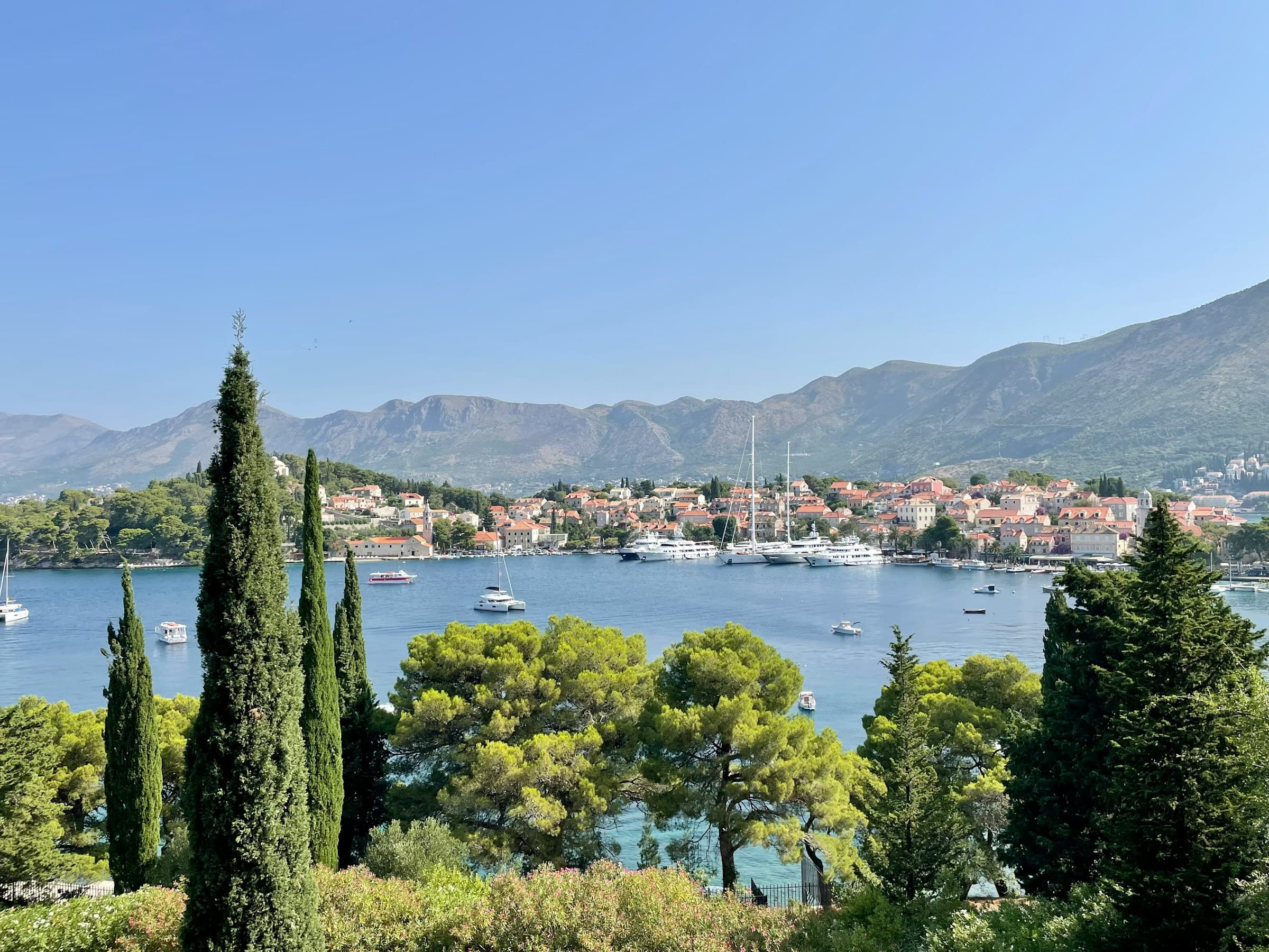 Cavtat harbor with boats and waterfront promenade in southern Dalmatia