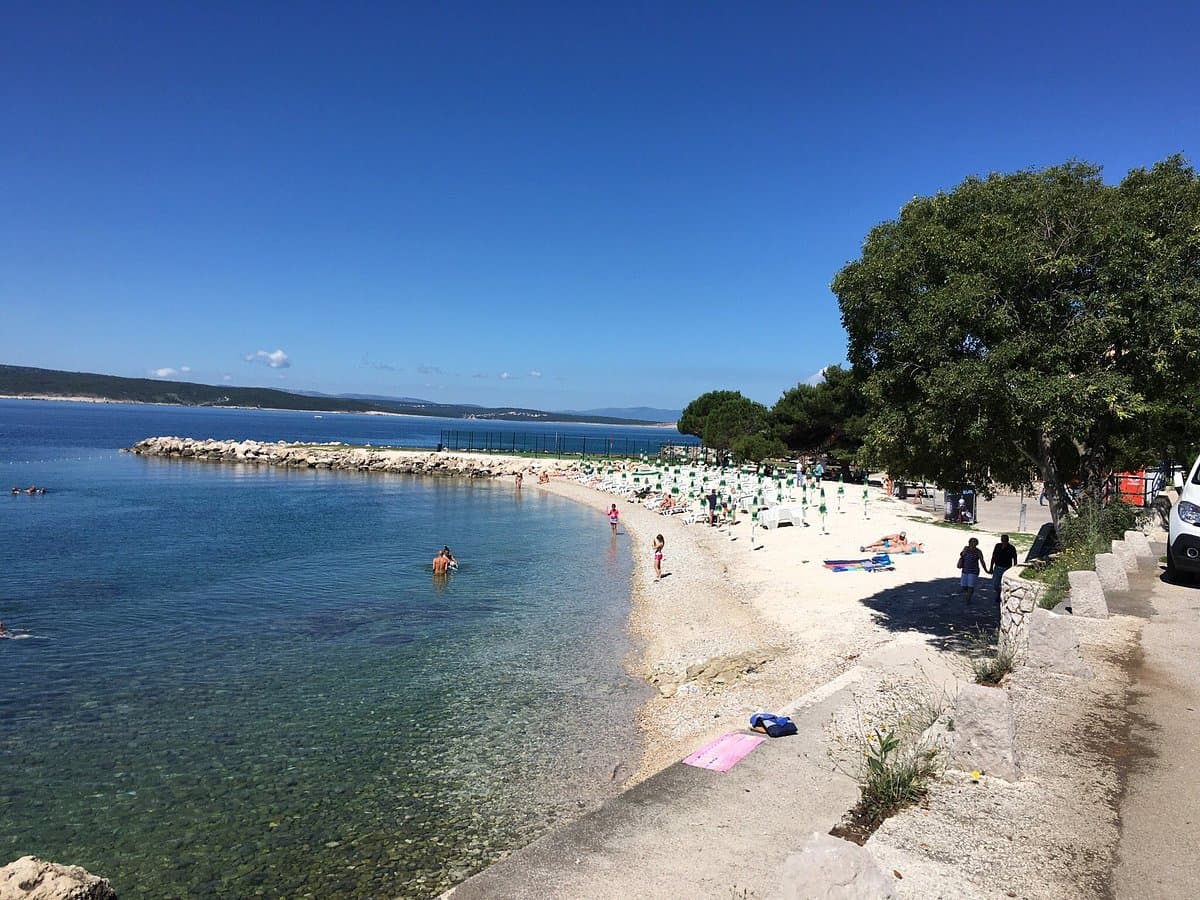 Crikvenica town beach and waterfront promenade in summer