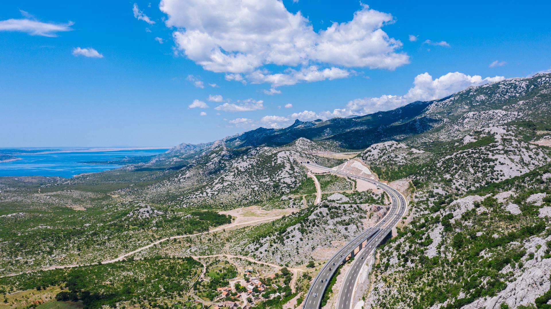 Off-road Jeep safari driving through rugged mountain trails in Velebit with panoramic Adriatic Sea views