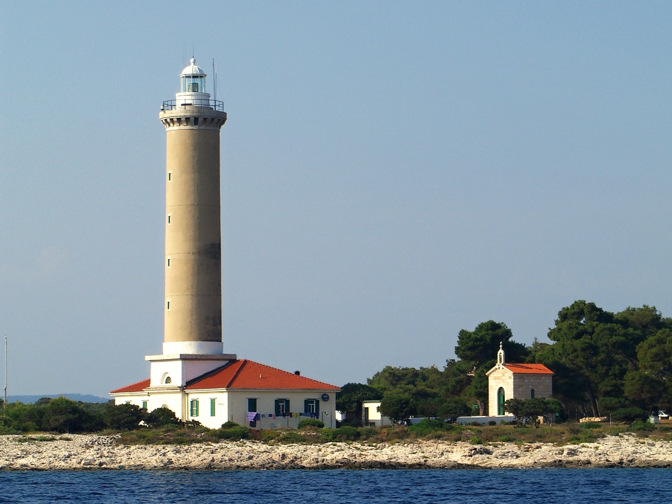 Veli Rat lighthouse on the northwestern cape of Dugi Otok, the tallest lighthouse on the Adriatic with faintly ochre walls.