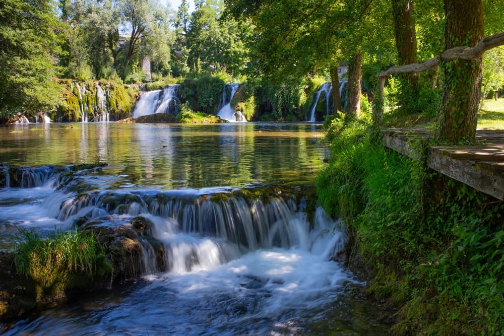 Rastoke watermill village with waterfalls flowing between traditional stone houses