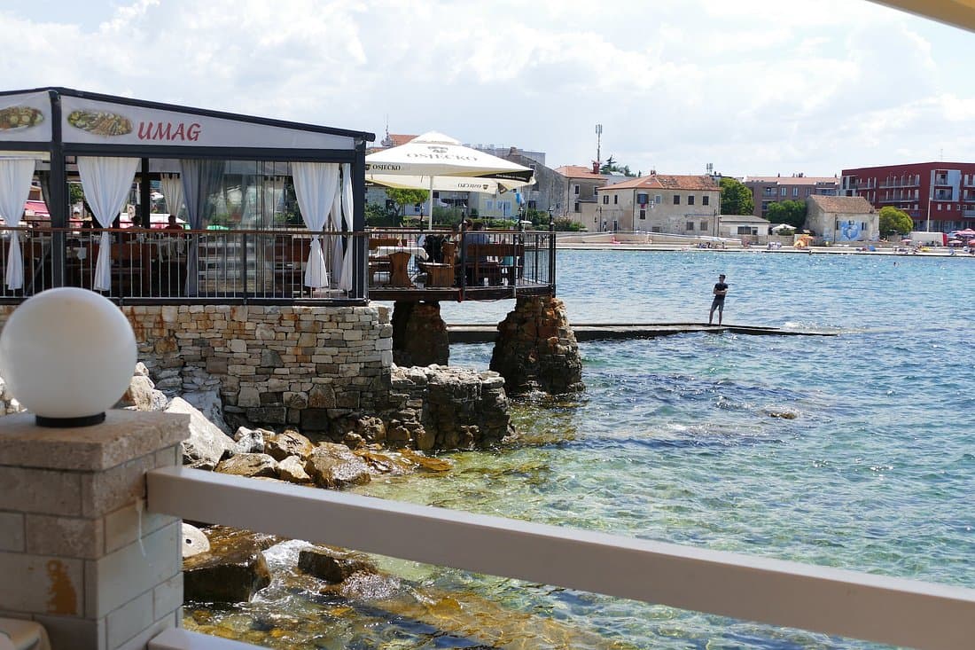 Umag marina and waterfront promenade with boats and sea views