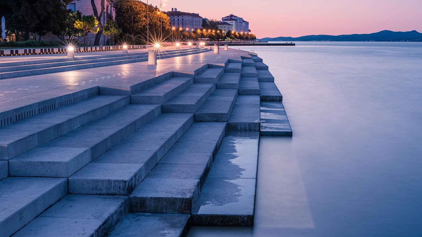 Zadar Sea Organ waterfront installation with waves and sunset light